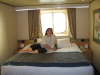 Large bed in stateroom with Champagne model