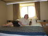 Large bed in stateroom with Champagne model